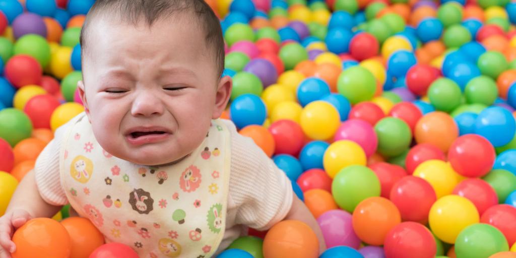 child in ball pit